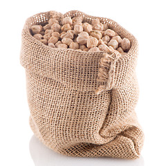 Image showing Uncooked chickpeas on burlap bag