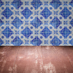 Image showing Wood table top and blur vintage ceramic tile pattern wall