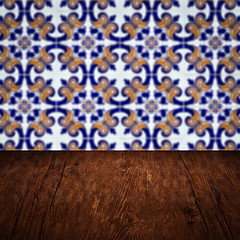 Image showing Wood table top and blur vintage ceramic tile pattern wall