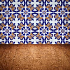 Image showing Wood table top and blur vintage ceramic tile pattern wall