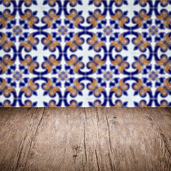 Image showing Wood table top and blur vintage ceramic tile pattern wall