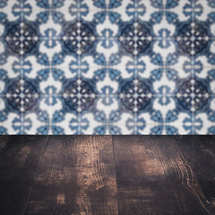 Image showing Wood table top and blur vintage ceramic tile pattern wall