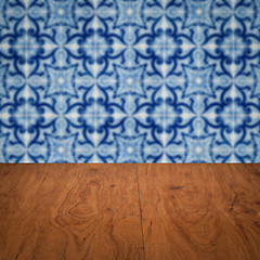 Image showing Wood table top and blur vintage ceramic tile pattern wall