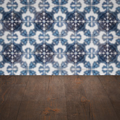 Image showing Wood table top and blur vintage ceramic tile pattern wall