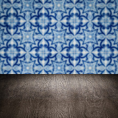 Image showing Wood table top and blur vintage ceramic tile pattern wall