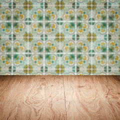 Image showing Wood table top and blur vintage ceramic tile pattern wall