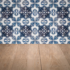 Image showing Wood table top and blur vintage ceramic tile pattern wall