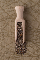 Image showing Wooden scoop with chia seeds