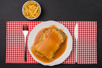 Image showing Francesinha and french fries