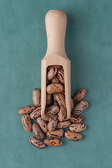 Image showing Wooden scoop with pinto beans