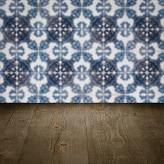 Image showing Wood table top and blur vintage ceramic tile pattern wall