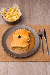 Image showing Francesinha and french fries