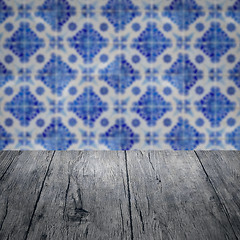 Image showing Wood table top and blur vintage ceramic tile pattern wall