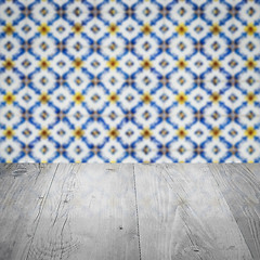 Image showing Wood table top and blur vintage ceramic tile pattern wall