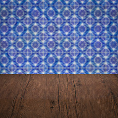 Image showing Wood table top and blur vintage ceramic tile pattern wall