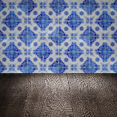 Image showing Wood table top and blur vintage ceramic tile pattern wall