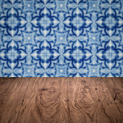 Image showing Wood table top and blur vintage ceramic tile pattern wall