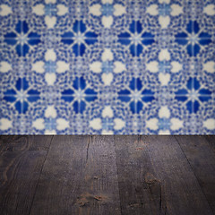 Image showing Wood table top and blur vintage ceramic tile pattern wall