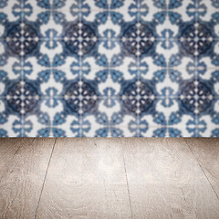 Image showing Wood table top and blur vintage ceramic tile pattern wall