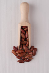 Image showing Wooden scoop with red beans