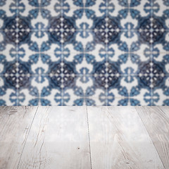 Image showing Wood table top and blur vintage ceramic tile pattern wall