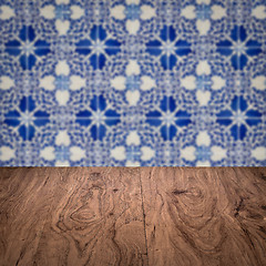 Image showing Wood table top and blur vintage ceramic tile pattern wall