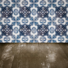 Image showing Wood table top and blur vintage ceramic tile pattern wall