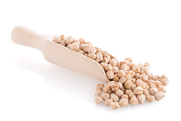 Image showing Uncooked chickpeas and wooden scoop