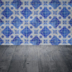 Image showing Wood table top and blur vintage ceramic tile pattern wall