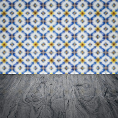 Image showing Wood table top and blur vintage ceramic tile pattern wall