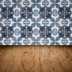 Image showing Wood table top and blur vintage ceramic tile pattern wall