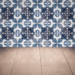 Image showing Wood table top and blur vintage ceramic tile pattern wall