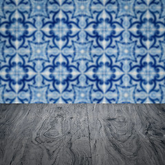 Image showing Wood table top and blur vintage ceramic tile pattern wall