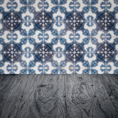 Image showing Wood table top and blur vintage ceramic tile pattern wall