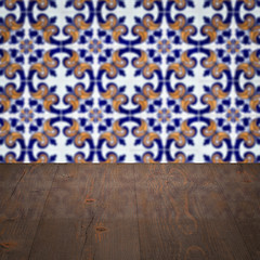 Image showing Wood table top and blur vintage ceramic tile pattern wall