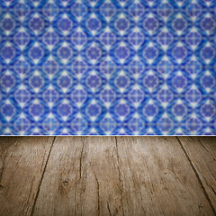 Image showing Wood table top and blur vintage ceramic tile pattern wall