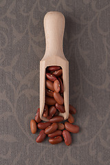 Image showing Wooden scoop with red beans