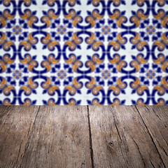 Image showing Wood table top and blur vintage ceramic tile pattern wall