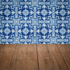 Image showing Wood table top and blur vintage ceramic tile pattern wall