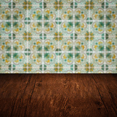 Image showing Wood table top and blur vintage ceramic tile pattern wall