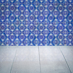 Image showing Wood table top and blur vintage ceramic tile pattern wall