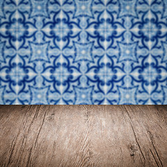 Image showing Wood table top and blur vintage ceramic tile pattern wall