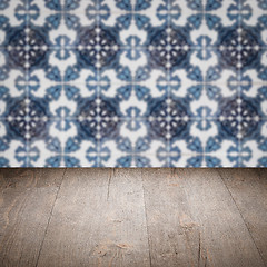 Image showing Wood table top and blur vintage ceramic tile pattern wall