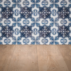 Image showing Wood table top and blur vintage ceramic tile pattern wall