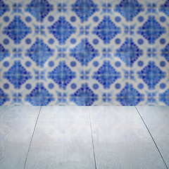 Image showing Wood table top and blur vintage ceramic tile pattern wall