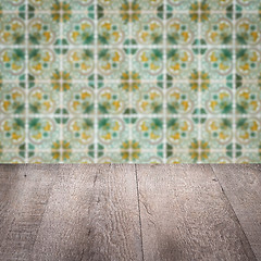 Image showing Wood table top and blur vintage ceramic tile pattern wall