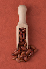 Image showing Wooden scoop with red beans