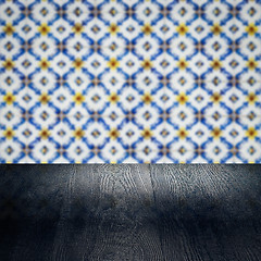 Image showing Wood table top and blur vintage ceramic tile pattern wall