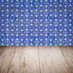 Image showing Wood table top and blur vintage ceramic tile pattern wall