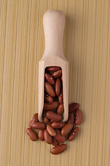 Image showing Wooden scoop with red beans